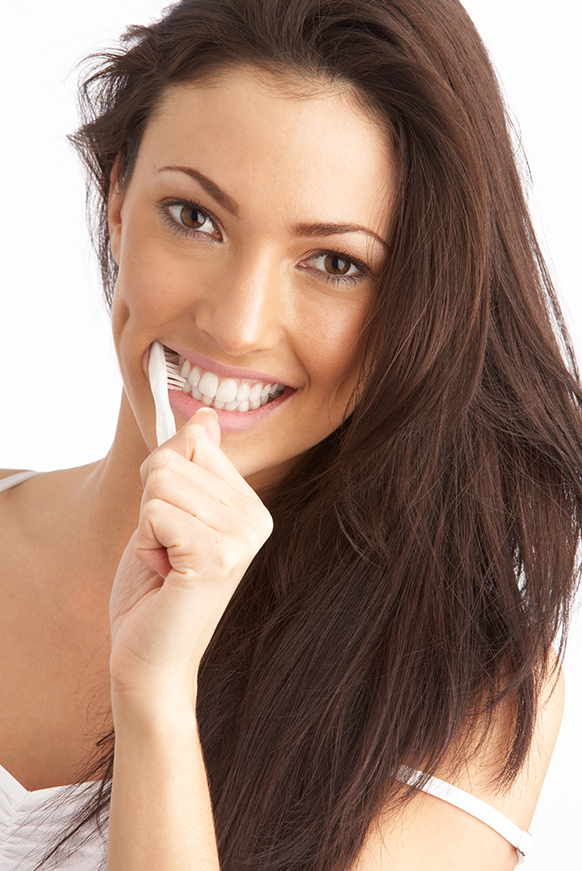Attractive woman bruching and cleaning here teeth