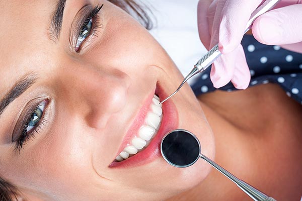 Miami Florida root canal - woman in dental chair preparing for root canal.