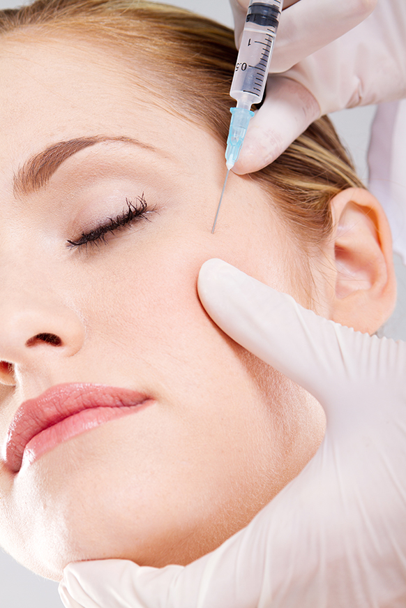 Attractive woman receiving Botox treatment