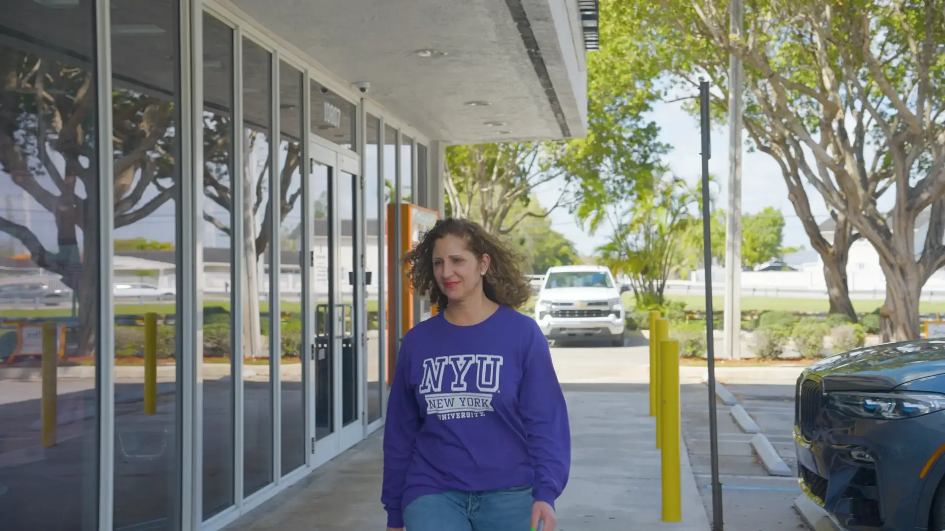 Patient walking in front of Jennifer Lopez Dental