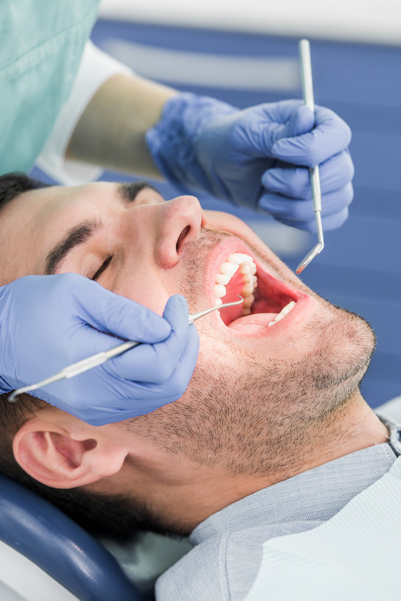 Man in dental chair receiving treatment